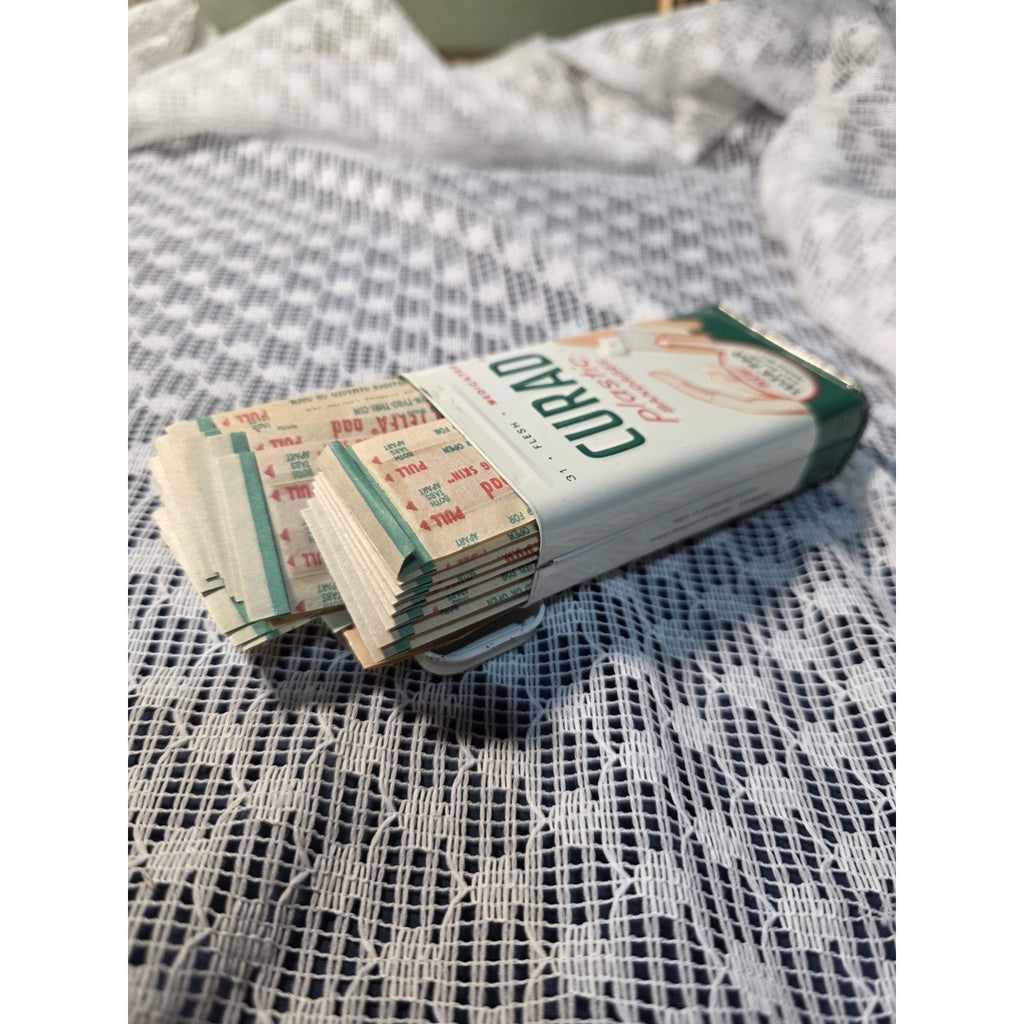 Vintage Curity Curad Tin Medicated Bandages 43 cent Embossed Tin W/ bandages